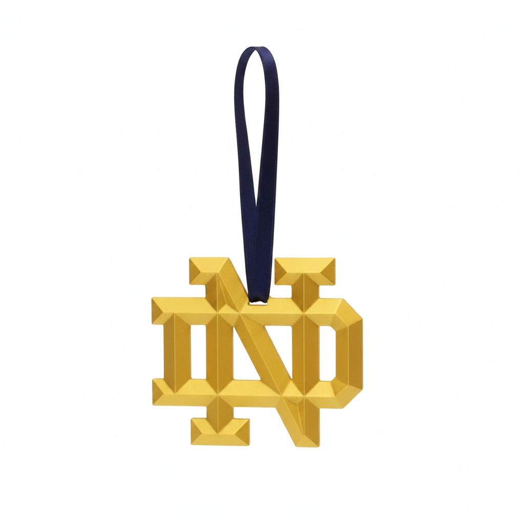 Gold 'ND' logo ornament with a black ribbon on a white background